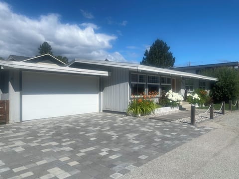 Front of house with garage and plenty of parking on driveway and street
