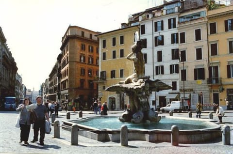 the Barberini square with the Triton Fountain and the building behind