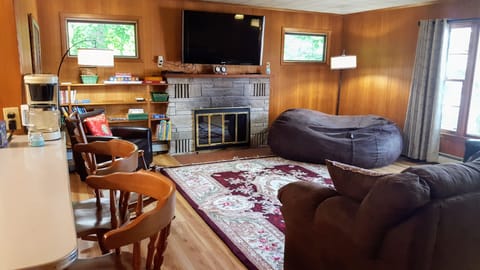 Living room. Kitchen bar to left.