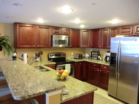Kitchen open to combined dining room and living room.