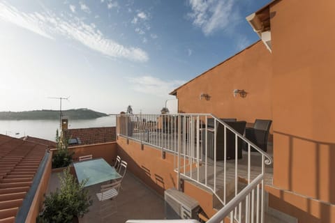 The lower terrace is cooler and good for dining.