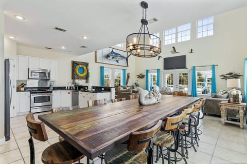 Spacious dining table set for shared meals & long conversations