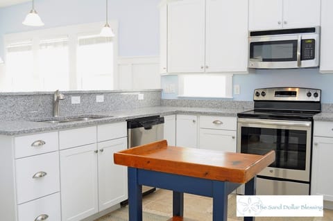 Lots of windows and work space in the kitchen - along with a dishwasher!