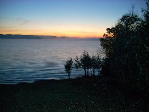 Twilight looking southeast from the deck, great room, & all 4 lakeside bedrooms.