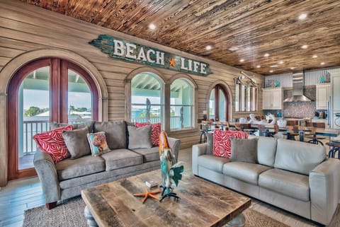 Cozy living area w/ layered seating, wood accents, and a welcoming coastal feel