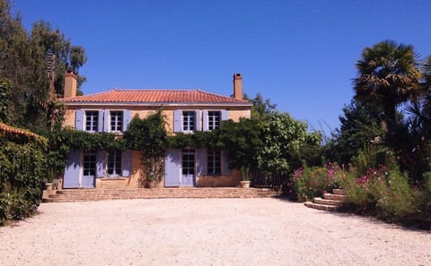 Front of the house from the lane - large pebble courtyard for your cars.