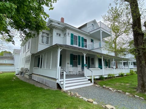 Petunias' wrap around front porch faces West Street.