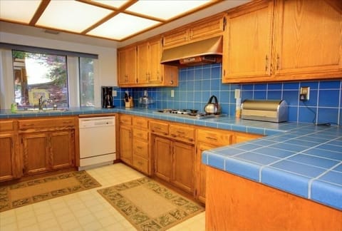 Fully equipped kitchen is located off dining room & has everything you need.