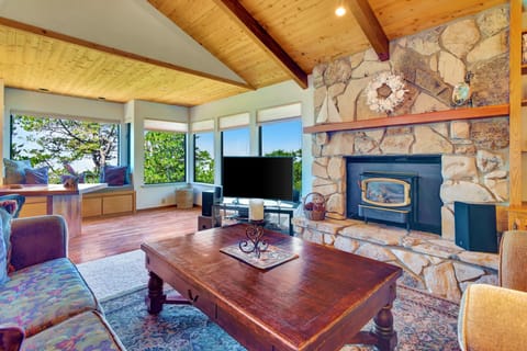 Living Room is spacious w/panoramic views of ocean. F/P is decorative only.