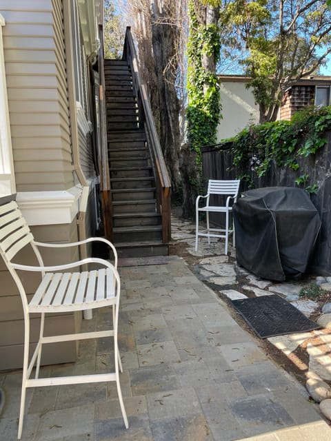 Stairs from second bedroom patio leading to backyard 