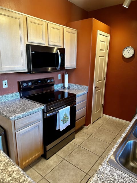 The kitchen has a pantry and 2 types of coffee makers, toaster, blender, mixer