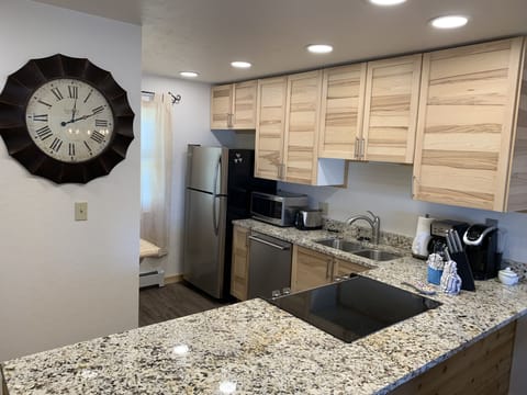 Kitchen with stainless steel appliances and granite countertop