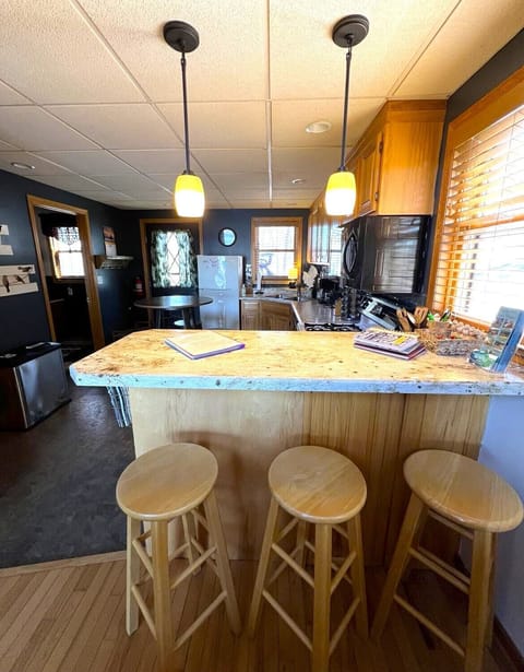 Pub height counter with stools