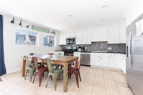 The kitchen opens out to the dining area, for easy group meals, game nights, you name it!
                