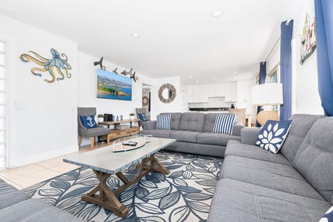 With plenty of natural light and beachy touches, this home will sweep you off your feet and into vacation mode!