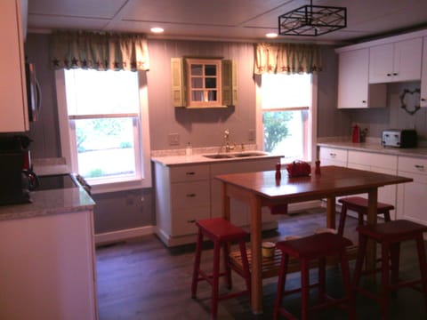 Breakfast bar doubles as center island.