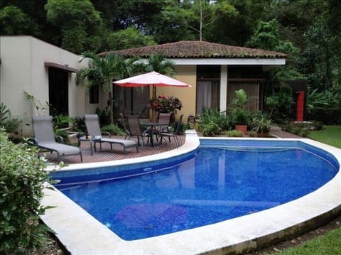 Private deck and pool with awesome view of rainforest covered mountain.