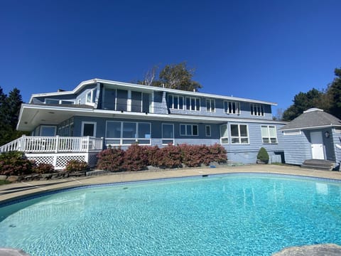 View of the house facing the ocean with the pool
