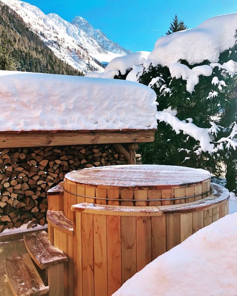 Beautiful cedar hot tub with breathtaking views of the Mont Blanc mountain range