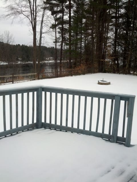Deck overlooking the lake (across the road) and the fire pit during the winter