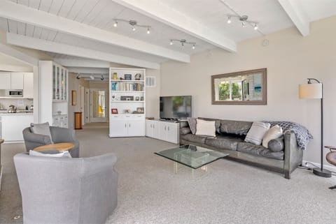 The living room opens to the dining area and kitchen