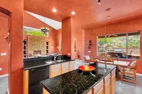 Open-concept kitchen connecting living and dining spaces