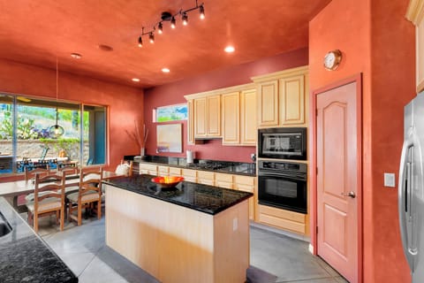 Expansive open kitchen with dining space and walk-in pantry