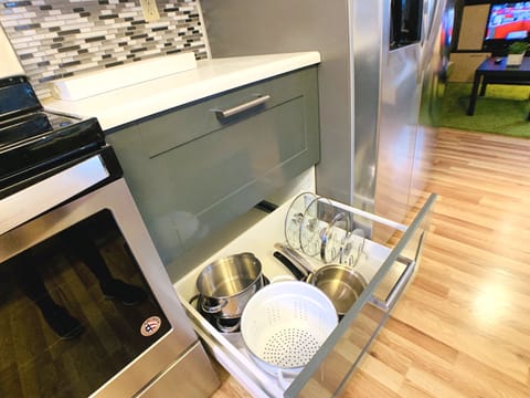 All the pots, pans, and cooking utensils you need to whip up a delicious meal.