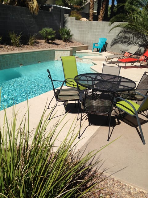 Patio dining by private pool and spa