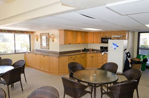 Meet others at scheduled events in the condo party room adjacent to the pool