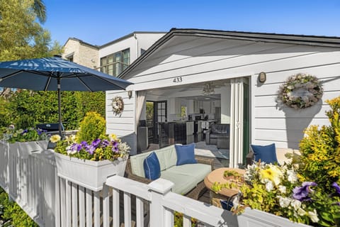 Deck with seating by fire pit, dining table, and barbecue