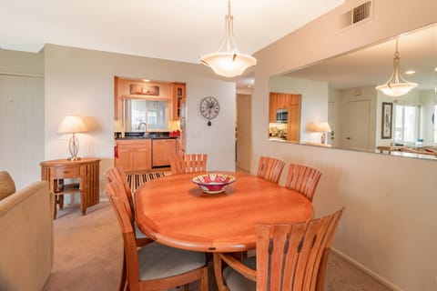 Teak dining room set for 6 that opens to accommodated 8.  Chairs in patio closet
