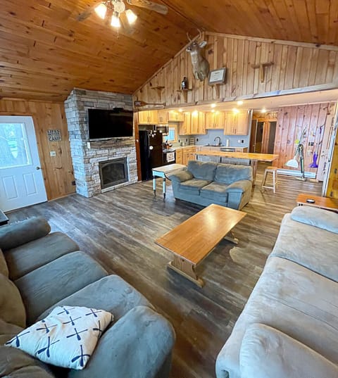 Open concept living room/kitchen w/ island.