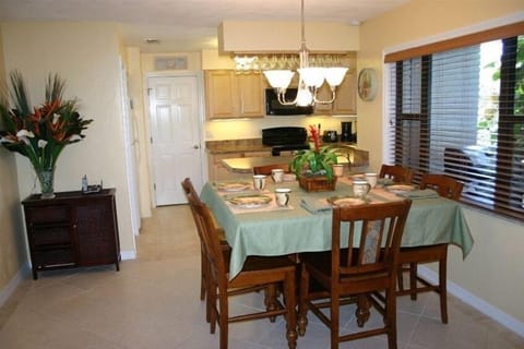 Dinning room and kitchen in background.