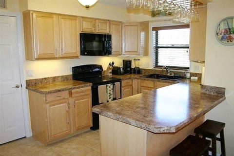 All the upscale appliances you need and hanging glasses for the boat drinks.