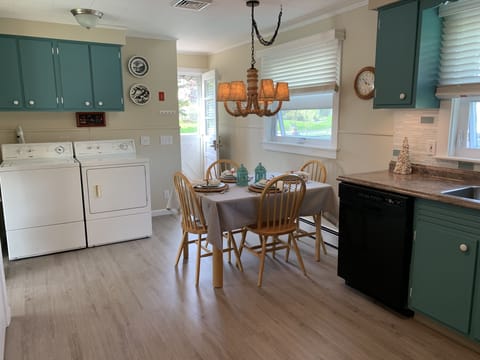 Kitchen with new flooring throughout the house, Washer and dryer