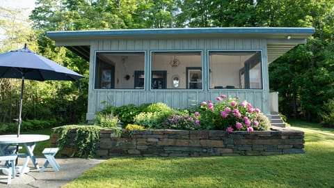 Early June photo of the cottage perennial garden and patio