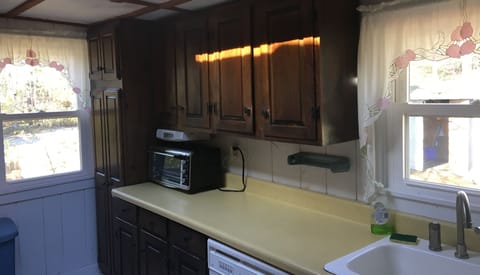 Kitchen with stove, microwave, dishwasher, toaster, etc.