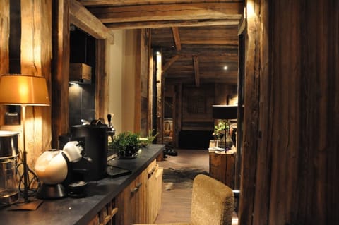 The corridor alongside the kitchen between the dining room and the living room