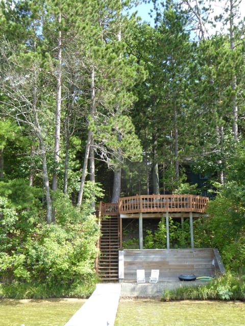 View fr. dock to the private lido,stairs & deck. Cottage is behind trees @ left.