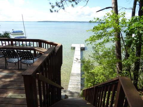 Private dock for this cottage, down stairs fr. deck. Clear, shallow lake bottom.