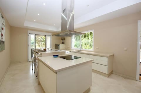 Modern kitchen fully fitted with quality appliances and access to the terrace