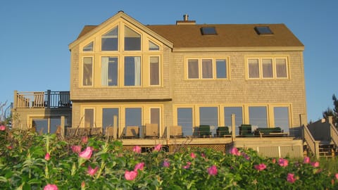 Savor the salty air & waves from the ocean deck spanning the length of the house