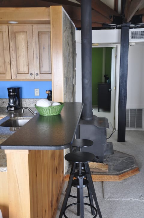 In addition to the kitchen table, there is bar seating as well.