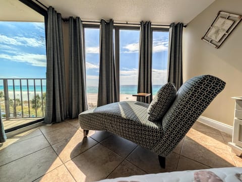 Sunlit lounge with panoramic Gulf views and fresh sea breeze