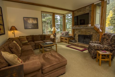 Gorgeous living room with sectional sofa and fireplace; exceptional space