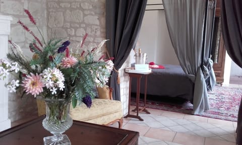 Hydrangea suite with a four poster bed, for a romantic stay.