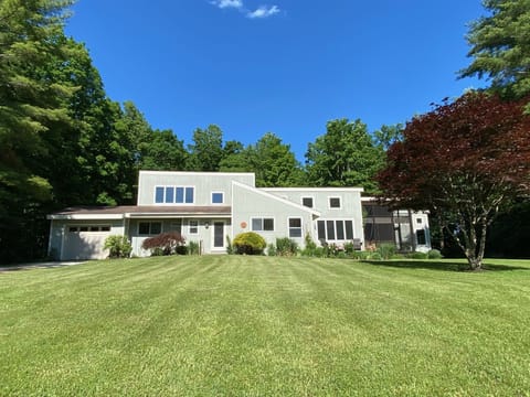 The house sits on 3 1/2 very private acres in a parklike setting.