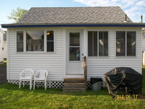 Front view of  Unit #136 Showing new kitchen windows and new enclosed porch.
