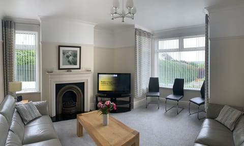 Large lounge looking onto sunny south facing fenced private garden